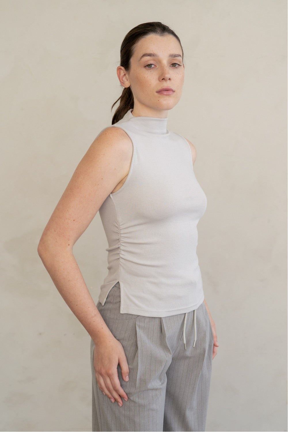 MOCK NECK SLEEVELESS KNIT TOP