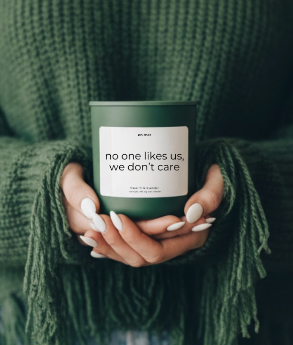 NO ONE LIKES US DON'T CARE CANDLE