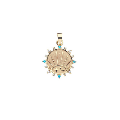 Gold pendant with gemstones on a white background