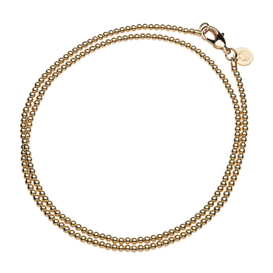 Gold chain bracelet on a white background