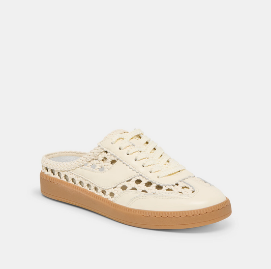 White sneaker with brown sole on a white background