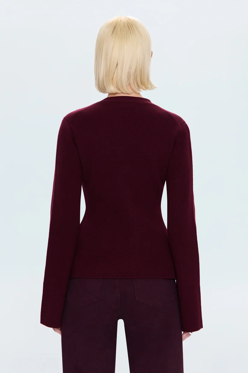 BACK OF RED SWEATER ON WHITE BACKGROUND