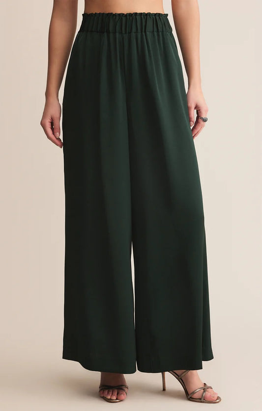 WOMEN WEARING GREEN SATIN PANTS