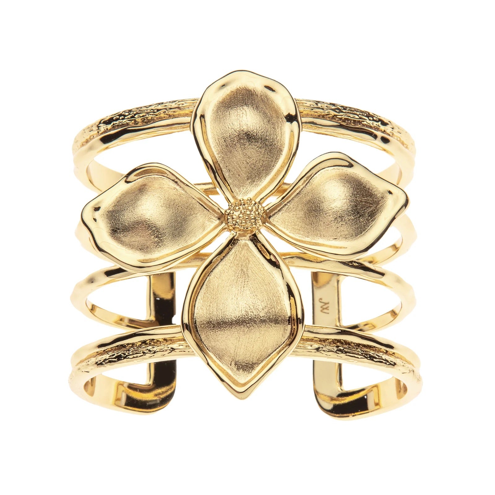 Gold four-leaf clover ring on a white background