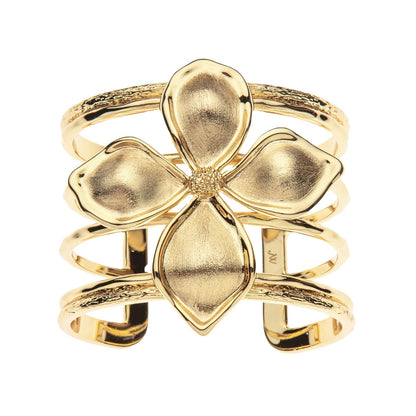 Gold four-leaf clover ring on a white background