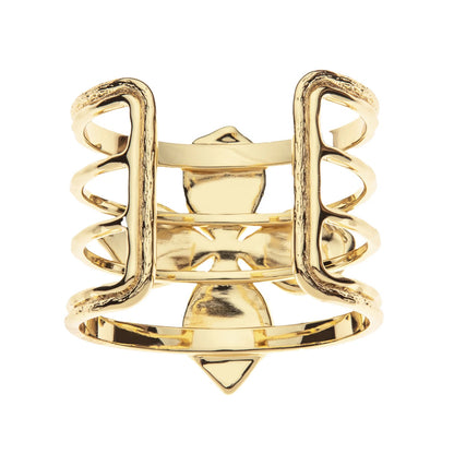 Gold ring with intricate design on a white background