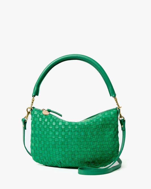 Green woven handbag on a white background