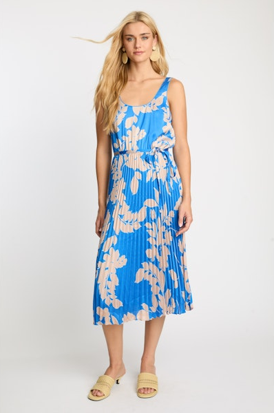 Woman wearing a blue floral dress on a white background