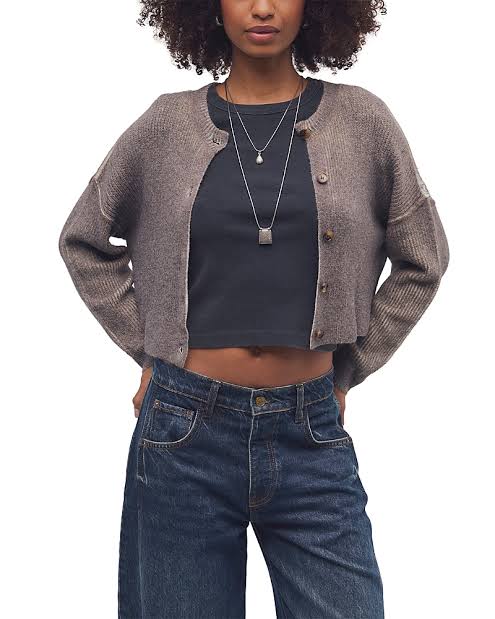 A cropped, textured taupe-brown cardigan sweater worn by a model over a black crop top and blue jeans, shown against a plain white background.