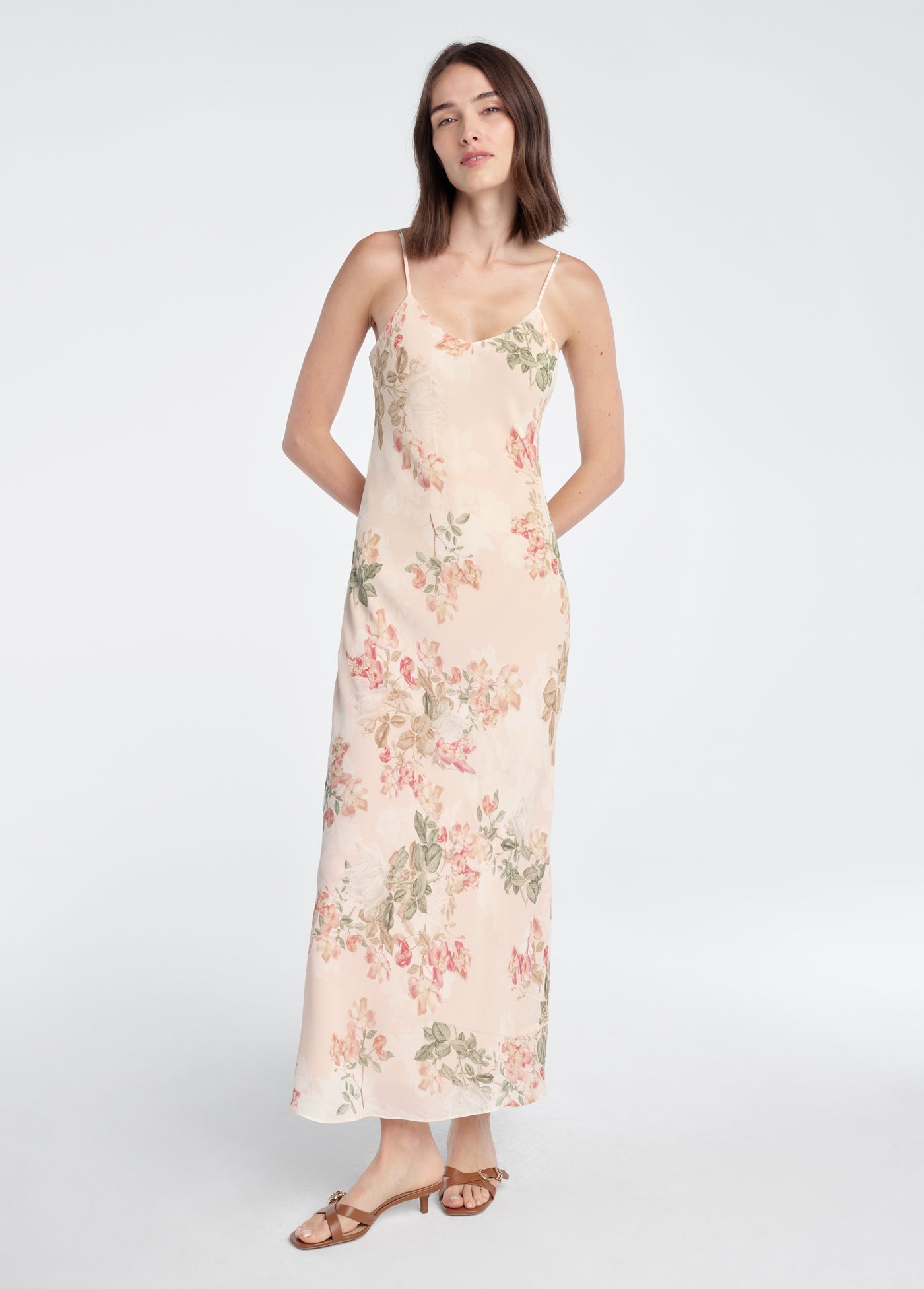 Woman wearing a floral dress on a white background