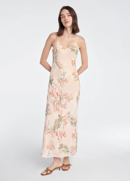 Woman wearing a floral dress on a white background