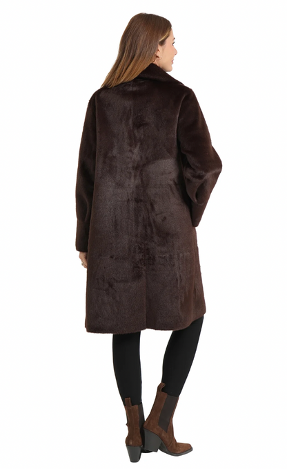 Woman wearing a brown fur coat on a white background