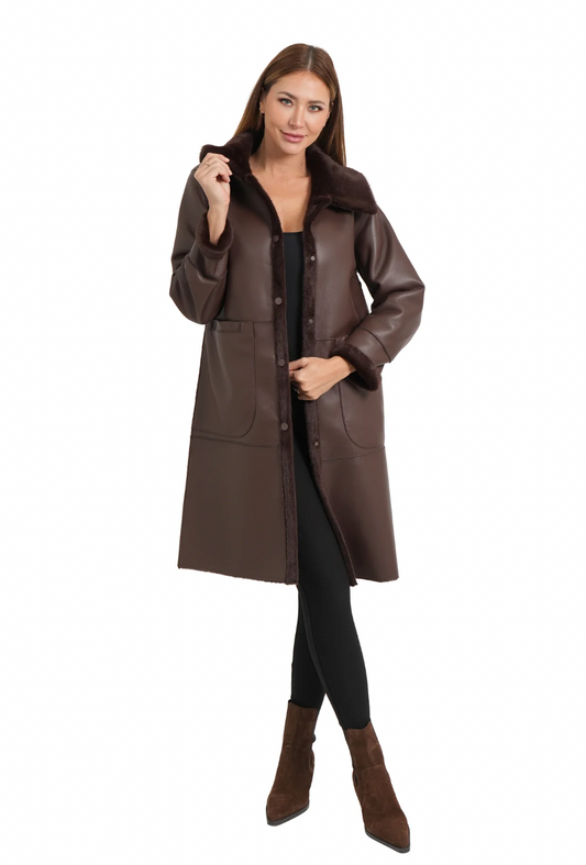 Woman wearing a brown coat on a white background