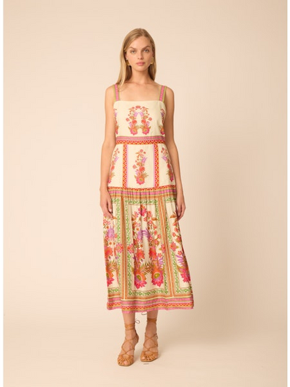 Woman wearing a floral dress on a beige background