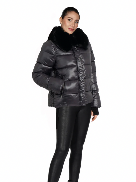 Woman wearing a black puffer jacket with fur trim on a white background